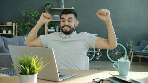 Man celebrating success while getting new leads