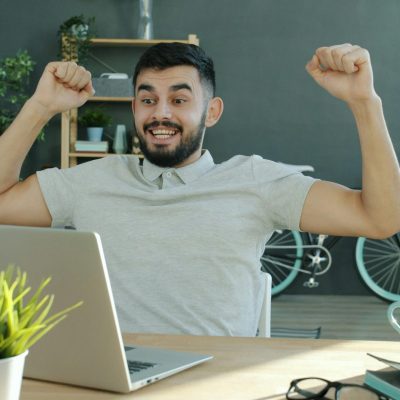 Man celebrating success while getting new leads